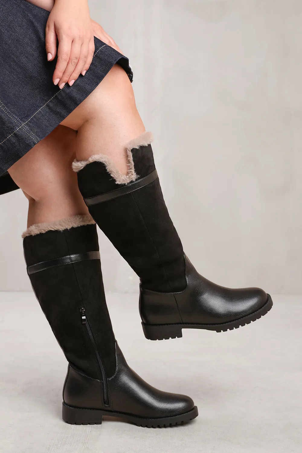 KENDRA WIDE CALF KNEE HIGH BOOTS WITH FUR TRIM AND LINING IN WIDE E FIT IN BLACK SUEDE AND FAUX LEATHER